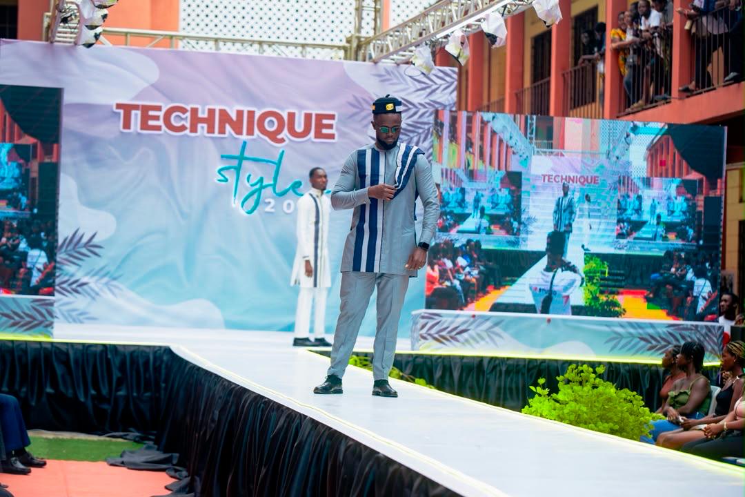 Grey and navy Kello Afrique tailored outfit presented on a runway